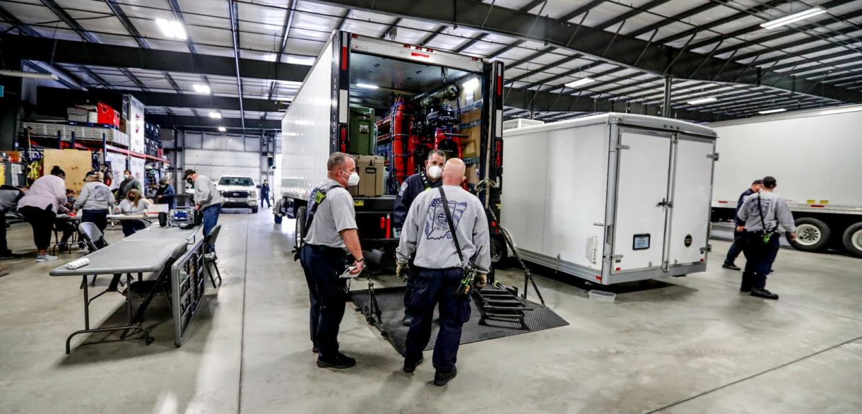 Members of Indiana Task Force 1 are activated to deploy for Mayfield, KY. as a NIMS Type 3 Urban Search & Rescue (US&R) Task Force on Saturday, Dec. 11, 2021, at the Indiana Task Force Bldg. in Indianapolis. 