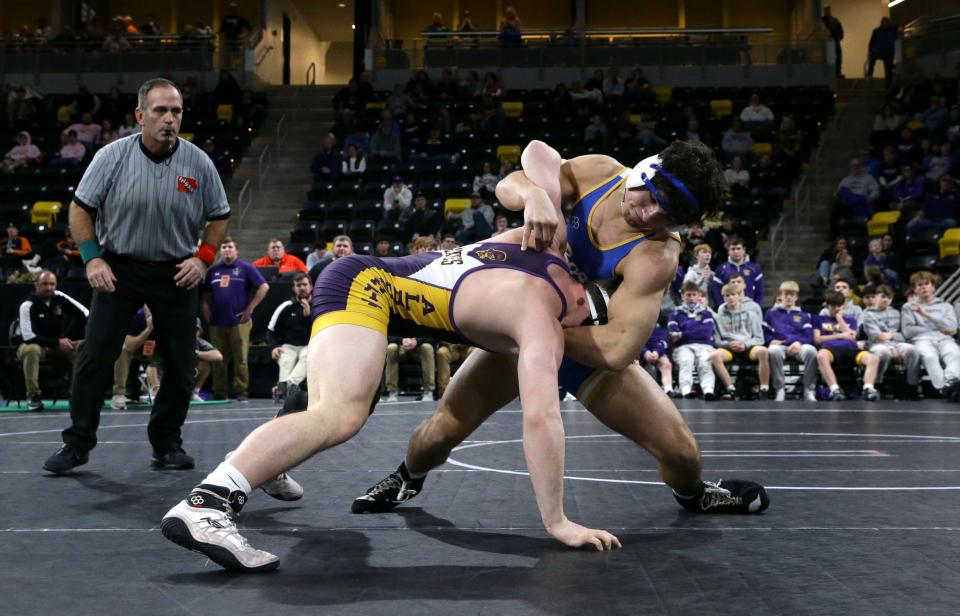 Don Bosco’s Landon Fernandez wrestles Alburnett’s Luke Schneider at the state duals tournament this year. Don Bosco is the overwhelming favorite to capture a team title, but Alburnett could pull the upset.