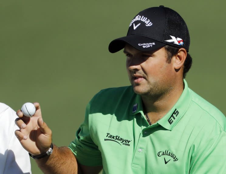 Patrick Reed holds up his ball after a par on the second hole during the first round of the Masters golf tournament Thursday, April 7, 2016, in Augusta, Ga. (AP Photo/Chris Carlson)