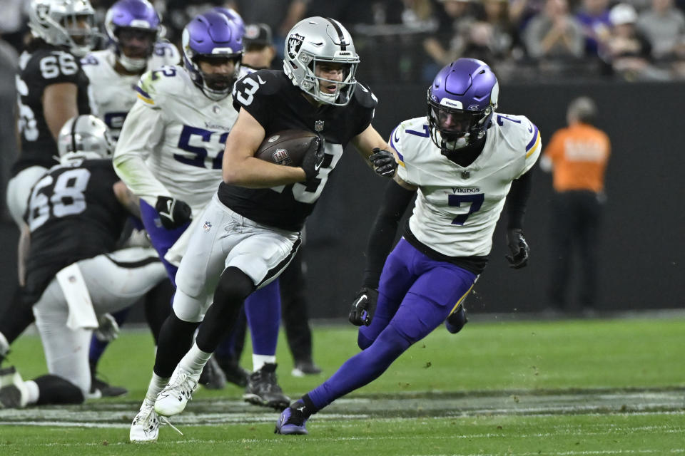 Las Vegas Raiders wide receiver Hunter Renfrow (13) runs as Minnesota Vikings cornerback Byron Murphy Jr. (7) pursues during the second half of an NFL football game, Sunday, Dec. 10, 2023, in Las Vegas. (AP Photo/David Becker)