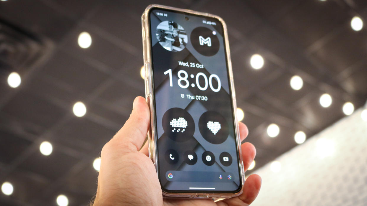  A picture of the Nothing Phone 2 with a customized home screen. 