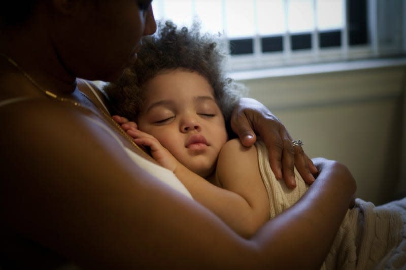 Woman holding her baby 