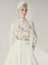 <p>Here's the look contemporary brides-to-be have been searching for. This belted ensemble by <a href="https://www.yolancris.com/" rel="nofollow noopener" target="_blank" data-ylk="slk:Yolancris;elm:context_link;itc:0;sec:content-canvas" class="link ">Yolancris</a> is actually a two-piece (a move the designers leaned into heavily this season!), composed of the lace "Sadie" body suit and the full, opaque "Vera" skirt, chunky belt and all. Needless to say, you'll wear both pieces again.</p>