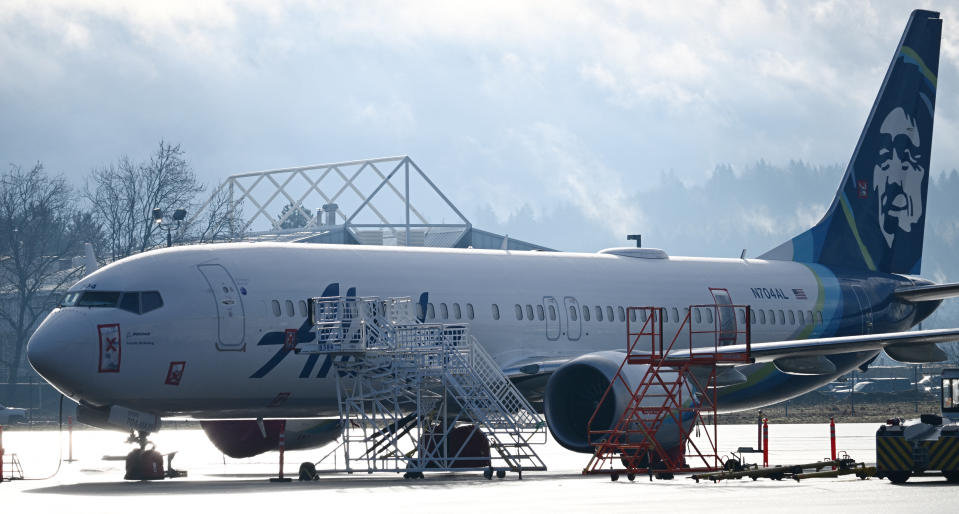 Alaska Airlines N704AL, a 737 Max 9, which made an emergency landing at Portland International Airport on January 5 is parked on the tarmac in Portland, Oregon, on January 23, 2024. One of two door plugs on the emergency exit door blew out shortly after the plane took off from Portland. No fatalities or injuries were reported. The US Federal Aviation Administration (FAA) announced January 11 it was launching a safety probe into Boeing's quality control. (Photo by Patrick T. Fallon / AFP) (Photo by PATRICK T. FALLON/AFP via Getty Images)