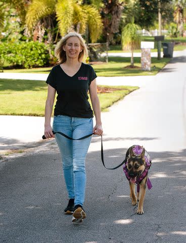 <p>Lori Griffith/Chasin A Dream Photography</p> Dog trainer and behaviorist Carrie MonteLeon with Gracie the German shepherd