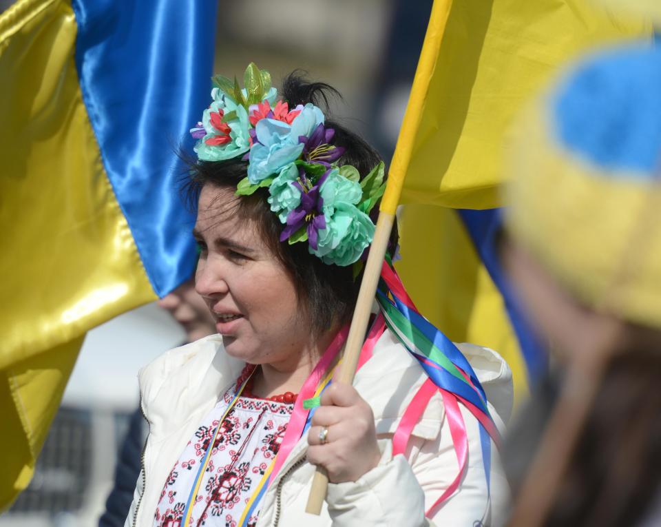 Inna Taylor, from Kyiv, Ukraine, joined with others from her country and supporters marching in a group at the annual Cape Cod St. Patrick's Parade in March in Yarmouth.