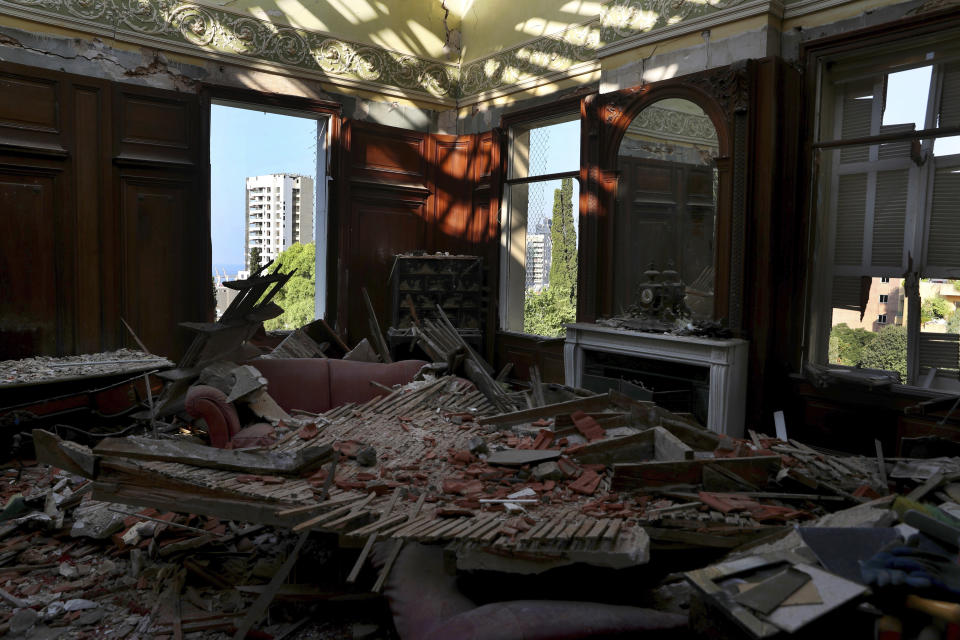 Debris from the ceiling and walls cover the floor of a room in the 150-year-old Sursock Palace, that was damaged by the Aug. 4 explosion that hit the seaport of Beirut, Lebanon, Monday, Sept. 14, 2020. Restoring Beirut's architectural heritage from the August blast will take hundreds of millions of dollars and costs will quickly rise if no action is taken ahead of the onset of the rainy season in less than two months time, international experts announced Tuesday. (AP Photo/Bilal Hussein)