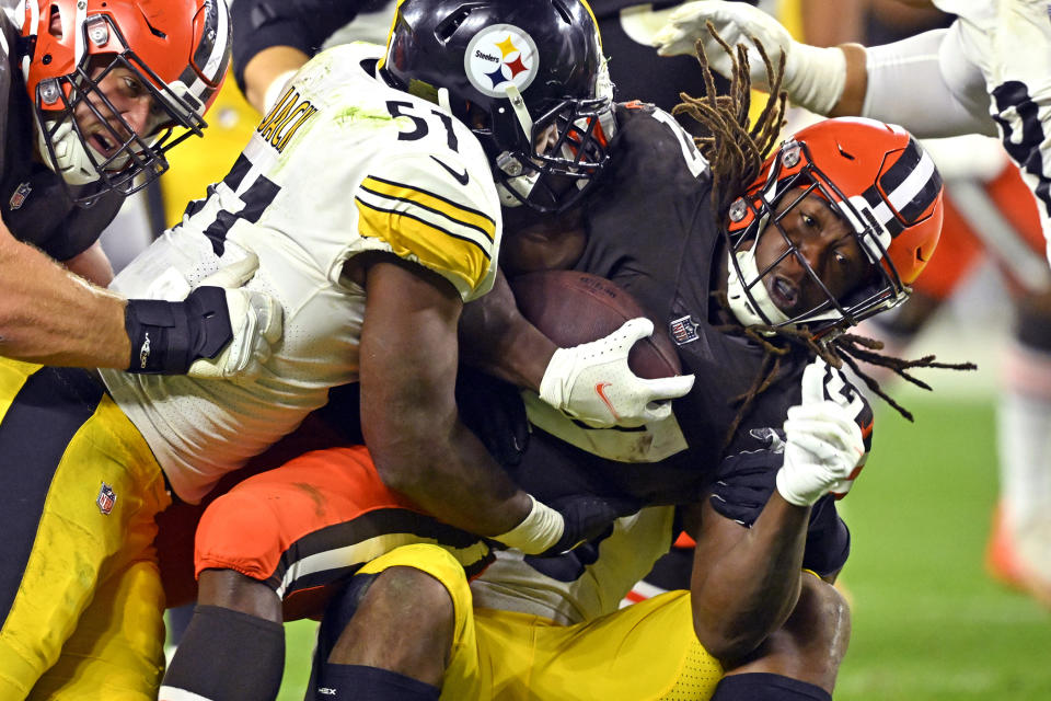 Cleveland Browns running back Kareem Hunt (27) is tackled by Pittsburgh Steelers linebacker Myles Jack (51) after a short gain during the second half of an NFL football game in Cleveland, Thursday, Sept. 22, 2022. (AP Photo/David Richard)