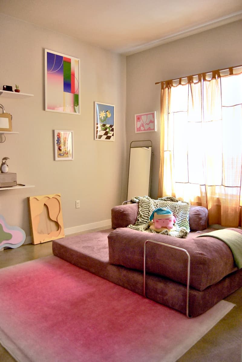 Pink seating area in pink bedroom.