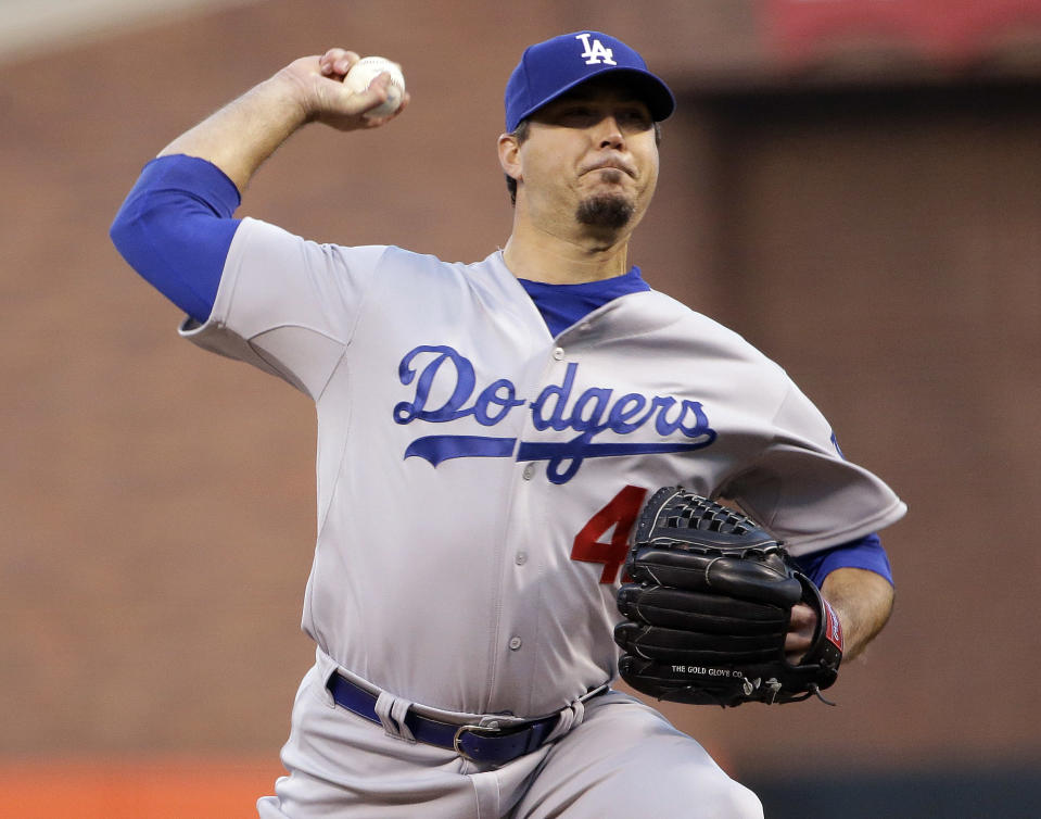 Los Angeles Dodgers starting pitcher Josh Beckett throws to the San Francisco Giants during the first inning of a baseball game Tuesday, April 15, 2014, in San Francisco. (AP Photo/Marcio Jose Sanchez)