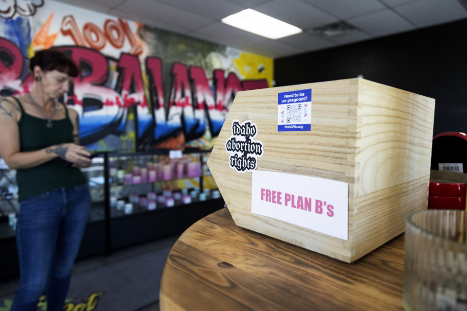 Jen Martindale delivers reproductive health materials to The Honey Pot CBD store in Boise, Idaho, on Saturday, April 13, 2024. The materials are part of kits which include condoms, dental dams, emergency contraceptives, along with sexual and reproductive healthcare pamphlets and are offered for free to businesses in Boise and surrounding areas of Idaho. (AP Photo/Kyle Green)