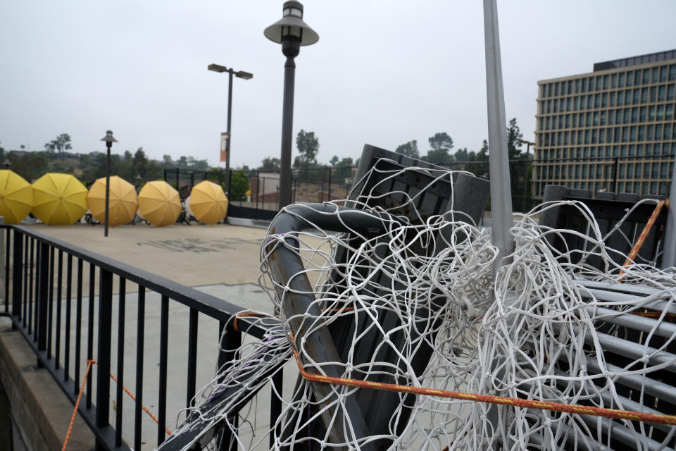 A barricade left by pro-Palestinian student protesters is seen left at California State University, Los Angeles campus in Los Angeles, Thursday, June 13, 2024. A takeover of a building at the university by demonstrators protesting Israel's war against Hamas in Gaza ended early Thursday, leaving the facility trashed and covered with graffiti, TV news reports showed. (AP Photo/Damian Dovarganes)