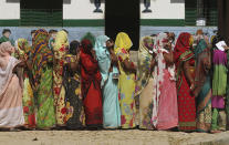 <p>Rural Hindu women with their faces covered stand in a queue to cast their votes at a polling station on the outskirts of Allahabad, Uttar Pradesh state, India, Feb. 23, 2017. (Photo: Rajesh Kumar Singh/AP) </p>