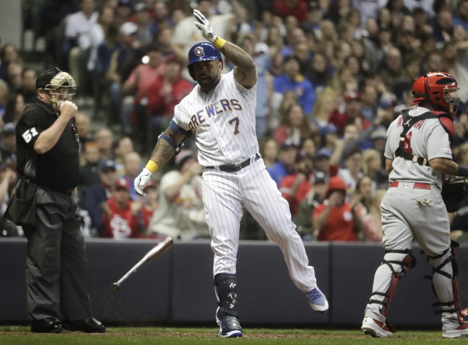 Milwaukee Brewers' Eric Thames reacts after striking out during the fourth inning of a baseball game against the St. Louis Cardinals Friday, March 29, 2019, in Milwaukee. (AP Photo/Morry Gash)