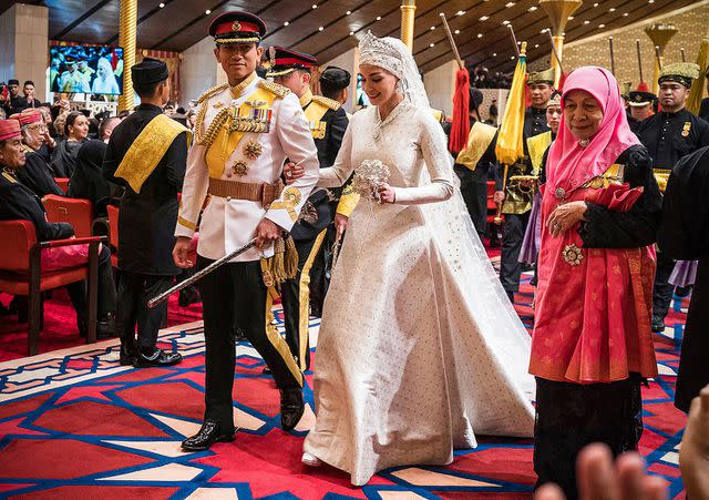 <p>IQBAL DATO HJ SELAMAT/AFP via Getty</p> Prince Abdul Mateen and Anisha at their wedding ceremony on Jan. 14, 2023
