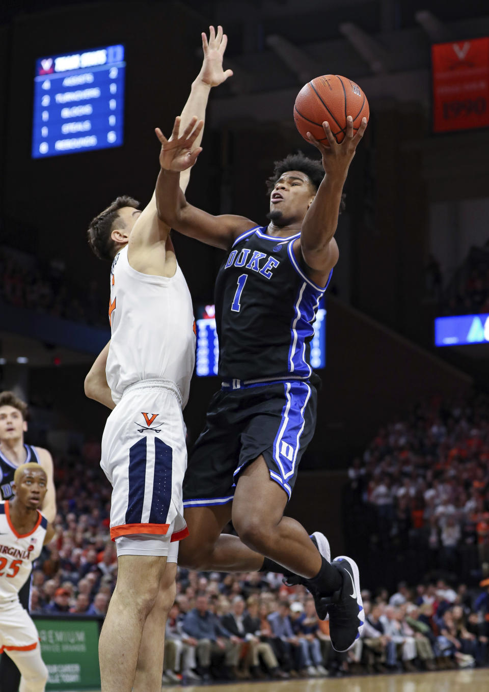 Duke center Vernon Carey Jr. (1) shoots next to Virginia center Francisco Caffaro (22) during an NCAA college basketball game Saturday, Feb. 29, 2020, in Charlottesville, Va. (AP Photo/Andrew Shurtleff)