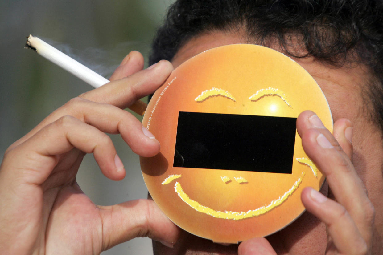 2005: A person observes the eclipse in Aiges-Mortes, France. 