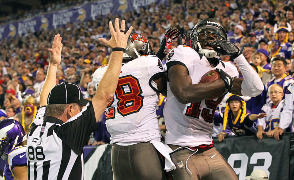 Mike Williams #19 Tampa Bay Buccaneers celebrates a touchdown with teammate D.J. Ware #28 against the Minnesota Vikings at the Hubert H. Humphrey Metrodome on October 25, 2012 in Minneapolis, Minnesota. (Photo by Adam Bettcher/Getty Images)