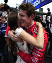 INDIANAPOLIS, IN - MAY 25: Scott Dixon of New Zealand, driver of the #9 Target Chip Ganassi Dallara Honda, celebrates with his wife Emma Dixon after winning the pit stop challenge on Carb Day for the Indianapolis 500 on May 25, 2012 at the Indianapolis Motor Speedway in Indianapolis, Indiana. (Photo by Robert Laberge/Getty Images)