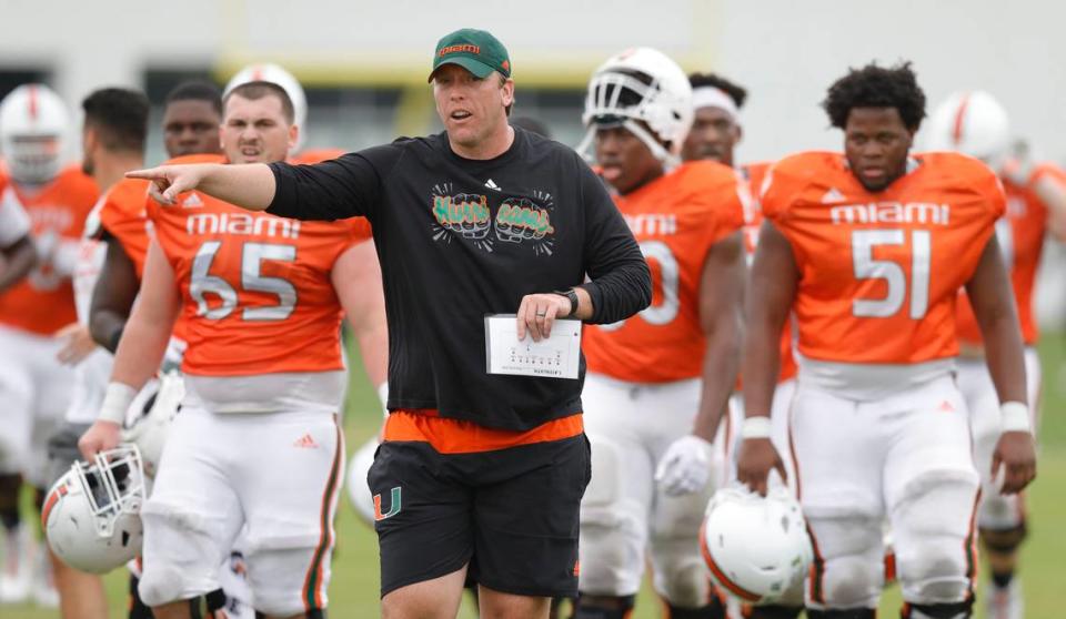 Miami Hurricanes offensive line coach, Garin Justice works with players during practice drills at the University of Miami’s Greentree Field in Coral Gables on Friday, March 6, 2020.