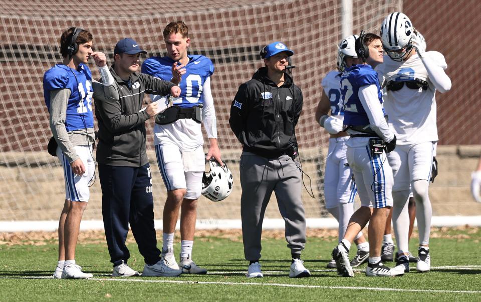 BYU offensive coordinator and quarterbacks coach Aaron Roderick, with Kedon Slovis (10) to his right, watches the action as the Cougars practice in Provo on Friday, March 17, 2023. | Scott G Winterton, Deseret News