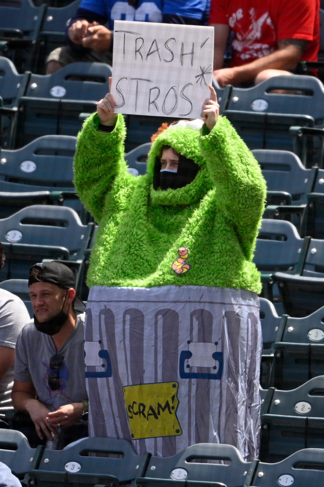 An Angels fan, dressed as Oscar the Grouch, mocks the Astros for banging on trash can lids during their sign-stealing scandal.