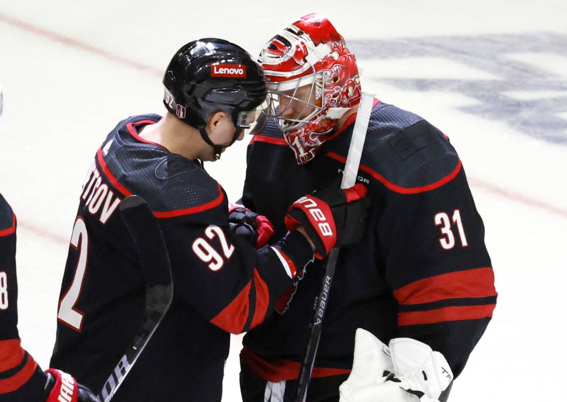 Carolina center Evgeny Kuznetsov (92) congratulates goaltender Frederik Andersen (31) after the Hurricanes’ 3-1 victory over the Islanders in the first round of the Stanley Cup playoffs at PNC Arena in Raleigh, N.C., Saturday, April 20, 2024.