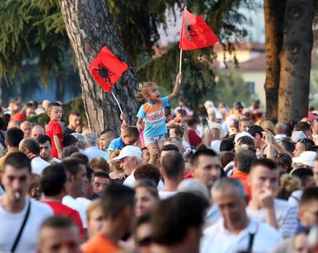 Supporters of the Socialist Party wave their flags during a post-elections rally in Tirana, Albania June 27, 2017. REUTERS/Florion Goga