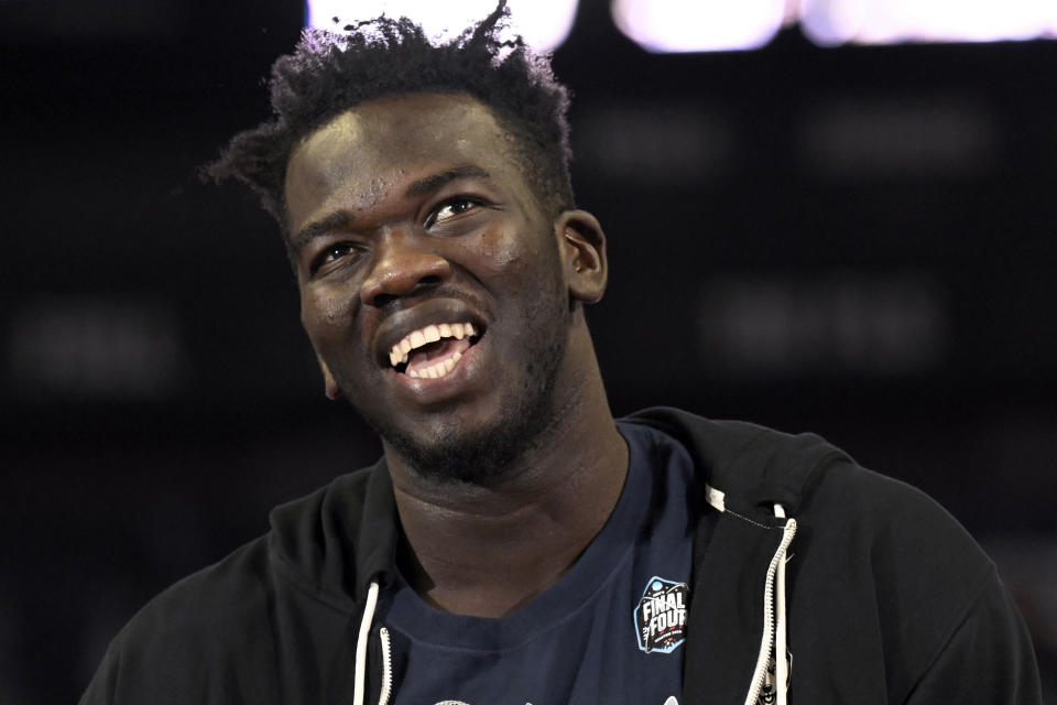 UConn's Adama Sanogo addresses fans during a rally at Gampel Pavilion celebrating UConn's NCAA men's Division I basketball championship, Tuesday, April 4, 2023, in Storrs, Conn. (AP Photo/Jessica Hill)