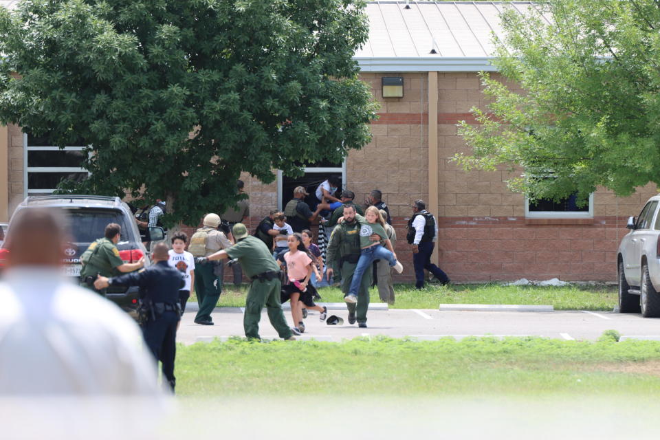 Children run from the scene of the shooting at Robb Elementary School in Uvalde, Texas, on May 24, 2022. / Credit: Pete Luna/Uvalde Leader-News