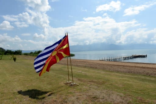 The flags of Greece and Macedonia flutter on the shores of Lake Prespa where last June's historic name deal was signed