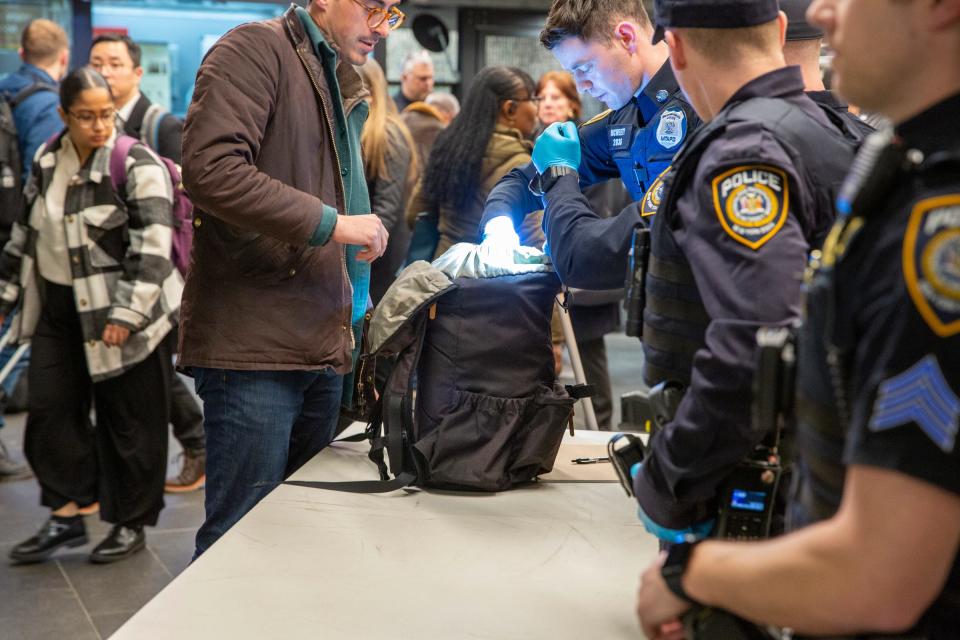 Members of the Armed Forces, including the National Guard, patrol last week in the New York City the subway system as police officers check commuters' bags. A man was shot and critically wounded Thursday with his own gun during a fight a week Gov. Kathy Hochul sent the National Guard to city's subway system to help police search passengers' bags for weapons.