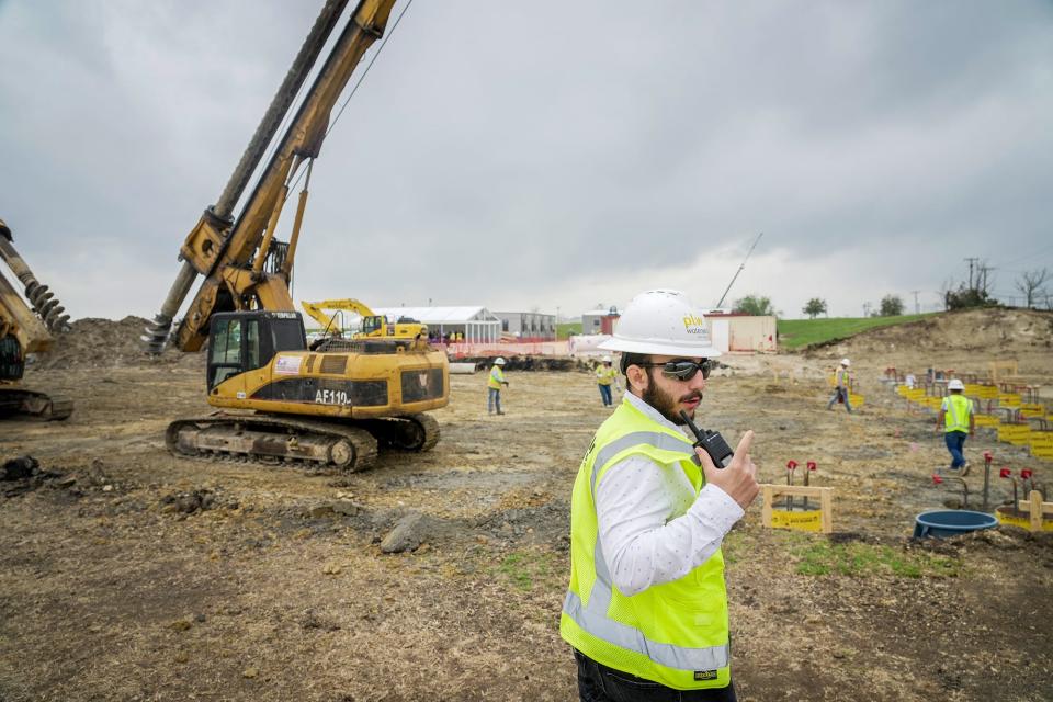 Construction engineer Jacobo Horcajo surveys the land in March at the site of expansion of Pflugerville's water treatment plant.