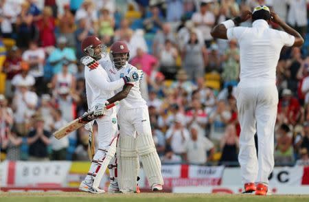 Cricket - West Indies v England - Third Test - Kensington Oval, Barbados - 3/5/15 West Indies' Denesh Ramdin and Jermaine Blackwood celebrate their victory Action Images via Reuters / Jason O'Brien