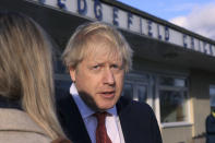 Britain's Prime Minister Boris Johnson, gives an interview during a visit to meet newly elected Conservative party MP for Sedgefield, Paul Howell, at Sedgefield Cricket Club in County Durham, north east England, Saturday Dec. 14, 2019, following his Conservative party's general election victory. Johnson called on Britons to put years of bitter divisions over the country's EU membership behind them as he vowed to use his resounding election victory to finally deliver Brexit. (Lindsey Parnaby/Pool via AP)