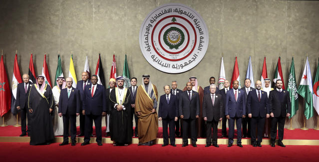 FILE - In this photo released by Lebanon's official government photographer Dalati Nohra, Lebanese President Michel Aoun, front row sixth from right, stands next to Qatar's Emir Sheikh Tamim bin Hamad Al Thani, fifth from left, and Mauritania's President Mohamed Ould Abdel Aziz, during a group picture with other leaders and head delegations, before the opening session of the Arab Economic Summit, in Beirut, Lebanon, Sunday, Jan. 20, 2019. Sheikh Tamim and the president of Mauritania were the only heads of state from the 22-member Arab League who came to Beirut to attend the summit. (Dalati Nohra via AP, File)