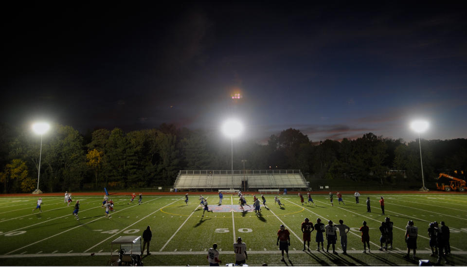 ALEXANDRIA  VA- OCTOBER 28 :  T.C. Williams Football team conducts practice  under a set of tempary lights. The Team  is hosting the first night football game in its 45-year history. To do so, the school is paying $24,000 to have an Iowa company bring in five sets of lights  at T.C. Williams High School  in Alexandria VA,  October 28, 2010. (Photo by John McDonnell/The Washington Post via Getty Images)