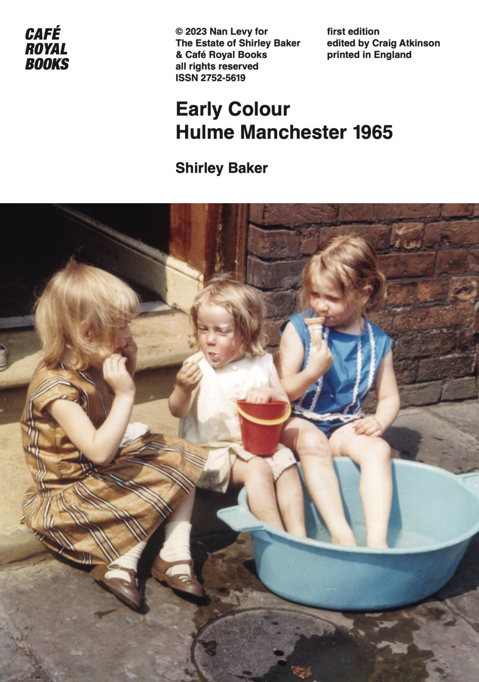 Publication cover with a colour photograph of three small girls sitting outside on a doorstep eating ice cream and ice lollies. Two of them have their feet in a blue bucket.