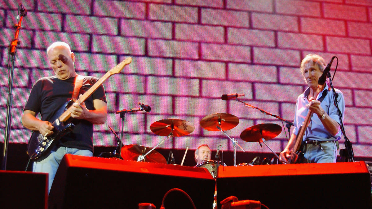  Pink Floyd's David Gilmour and Roger Waters perform on stage at "Live 8 London" in Hyde Park on July 2, 2005 in London, England. 