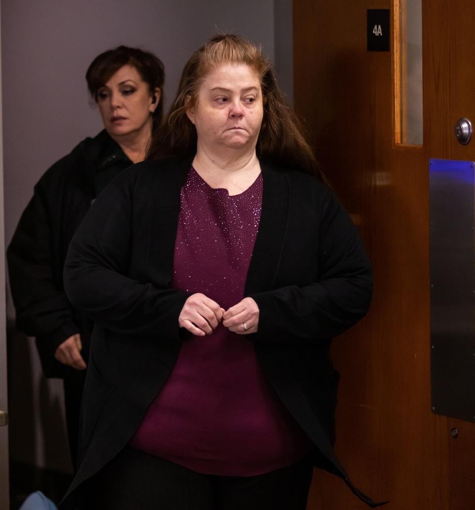 Jennifer S. Hill is led into the courtroom by a bailiff after a break in her second-degree murder trial on Tuesday morning at the Marion County Judicial Center in Ocala.