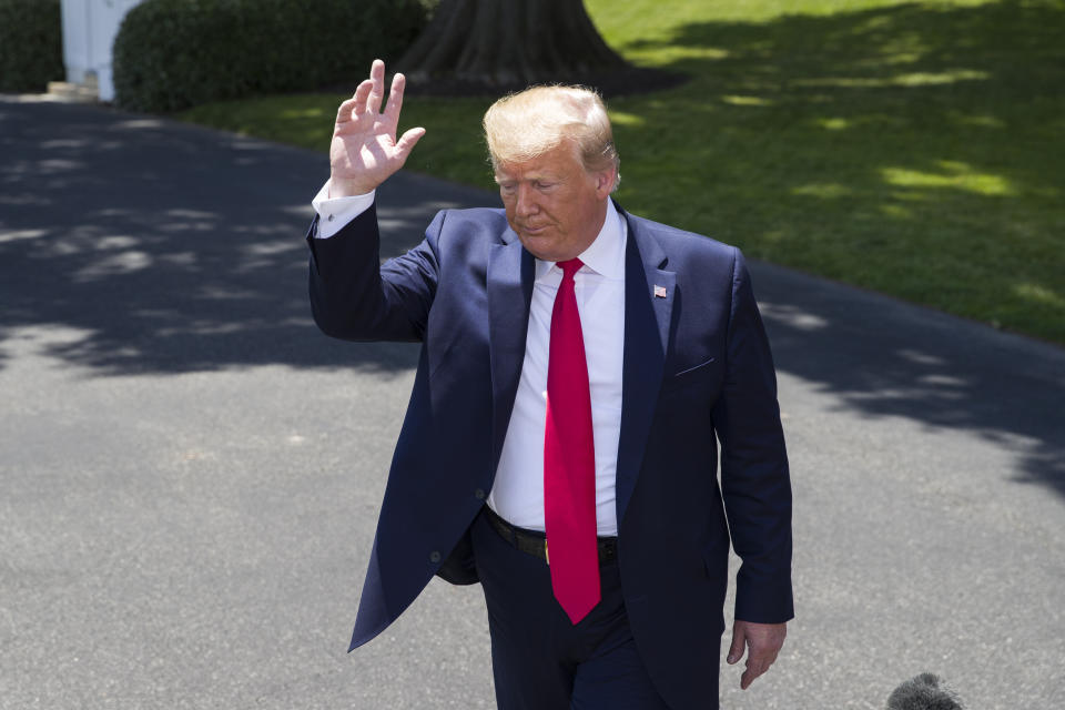 President Donald Trump waves as he departs after speaking with reporters on the South Lawn of the White House, Wednesday, June 26, 2019, in Washington. Trump is en route to Japan for the G-20 summit. (AP Photo/Alex Brandon)