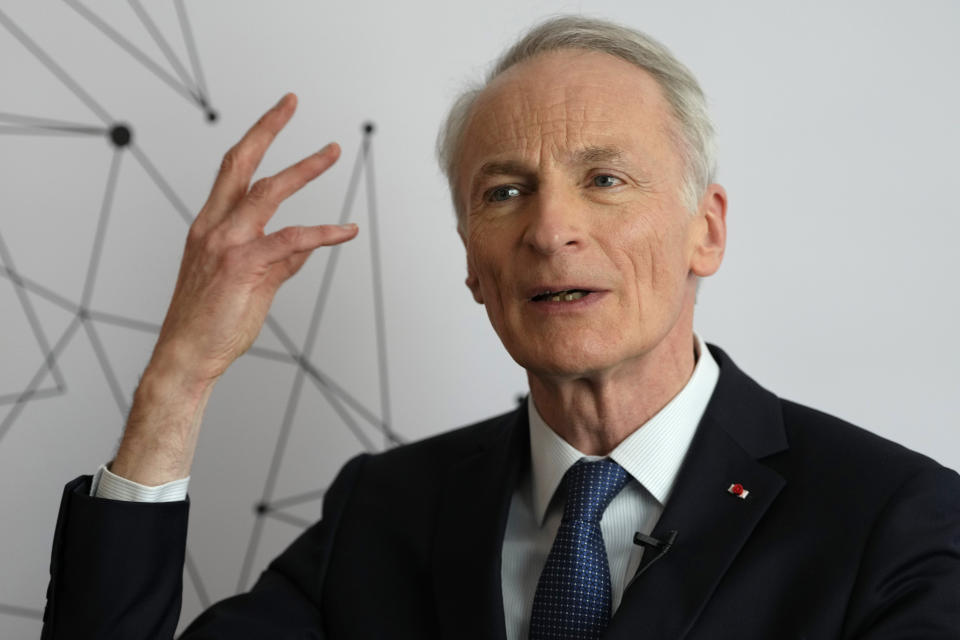 Jean-Dominique Senard, Chairman of the Board of Directors at Renault Group speaks during an interview with The Associated Press after a Renault Nissan Mitsubishi press conference in London, Monday, Feb. 6, 2023. The boards of Renault and Nissan have approved equalizing the stake each automaker holds in the other, bringing a better balance in the French-Japanese alliance. Under the decision announced Monday, both companies will own 15% in the other. (AP Photo/Kirsty Wigglesworth)