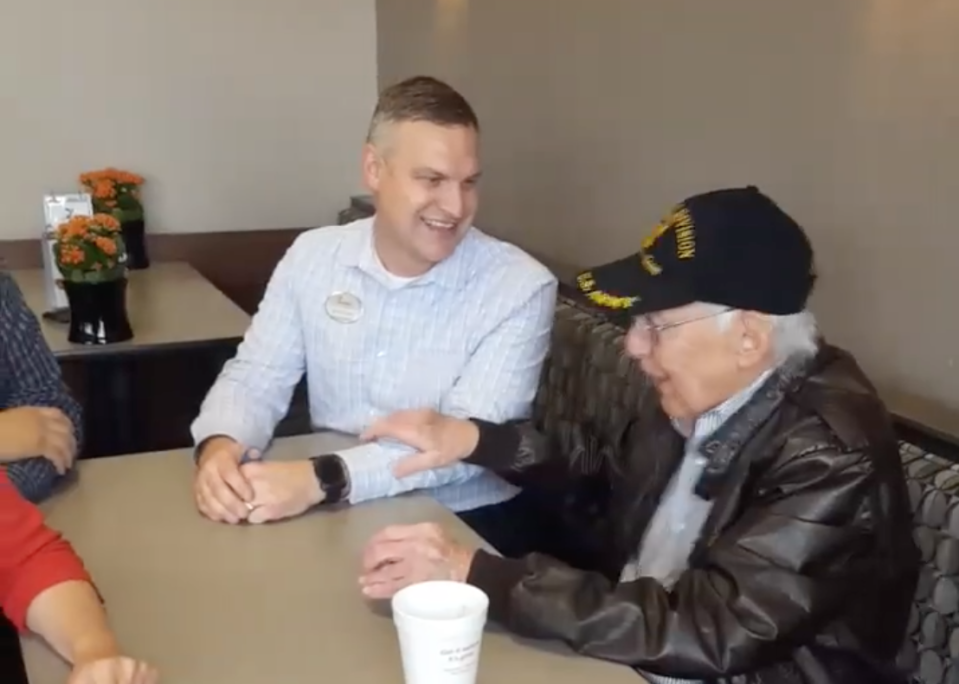 Ernie, a World War II veteran, sits with Chris Tincher, owner of the Avon, Ind., Chick-fil-A, which is honoring him with free food for life. (Photo: Facebook)