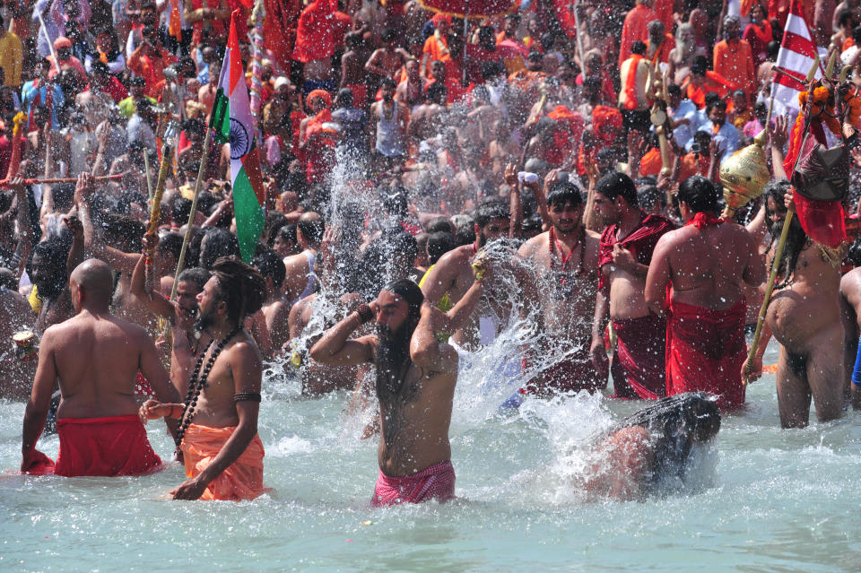 Naga Sadhus or holy man of Niranjani Akhara take a holy dip in Ganges River on the occasion of first royal bath of Shivratri festival during Maha Kumbh Festival , in Haridwar on March 11, 2021 . (Photo by Ritesh Shukla/NurPhoto via Getty Images)