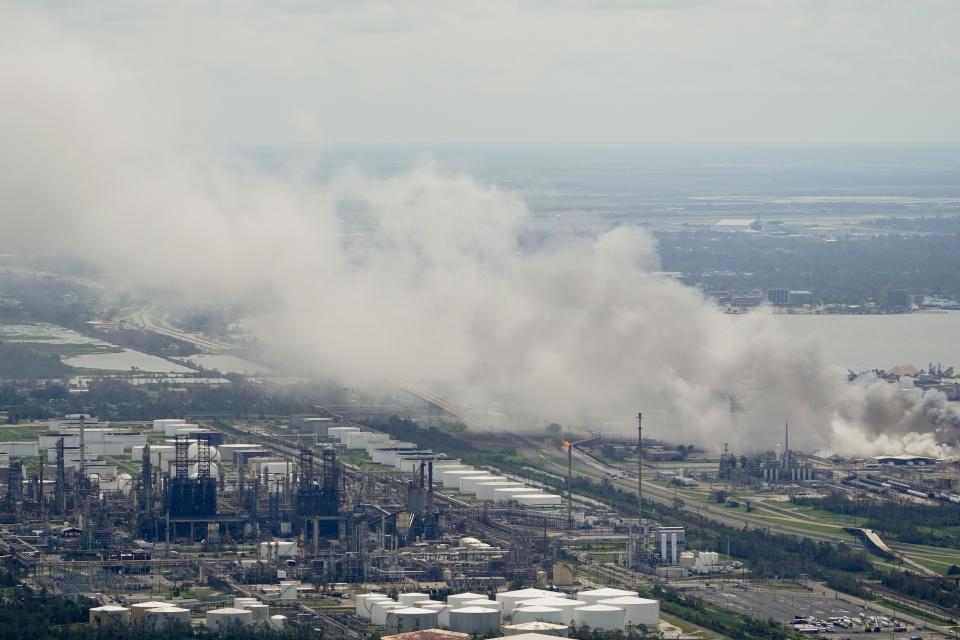 A chemical fire burns at a facility during the aftermath of Hurricane Laura Thursday, Aug. 27, 2020, near Lake Charles, La. (AP Photo/David J. Phillip)
