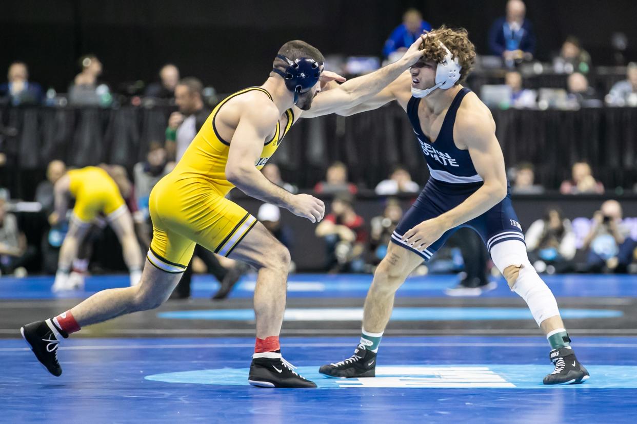 Mar 22, 2024; Kansas City, MO, USA; Cameron Amine of Michigan wrestles Mitchell Mesenbrink of Penn State during the quarterfinal of the Men’s Division I NCAA Wrestling Championships at T-Mobile Center. Mandatory Credit: Nick Tre. Smith-USA TODAY Sports