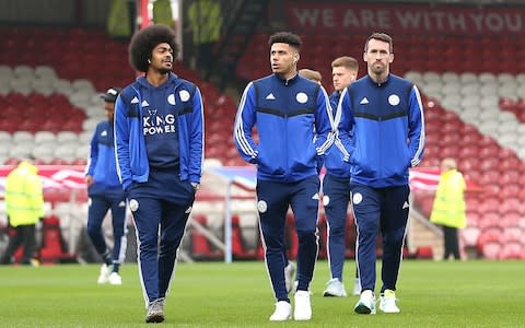 Leicester City's Hamza Choudhury (left), James Justin and Christian Fuchs inspects the pitch ahead of the FA Cup fourth round match at Griffin Park, London. - Credit: PA