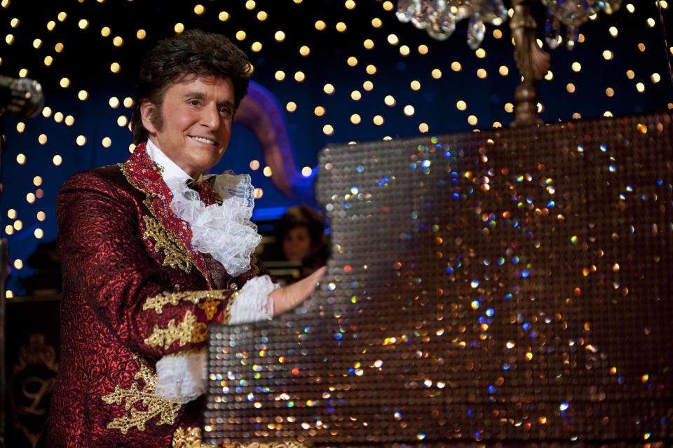 This film image released by HBO shows Michael Douglas as Liberace in a scene from "Behind the Candelabra." his splashy and poignant portrait of "Mr. Showmanship," Liberace, proved a dual career triumph for Michael Douglas, who portrayed him, and Matt Damon, who was no less impressive as the Vegas superstar's tempestuous lover. (AP Photo/HBO, Claudette Barius)