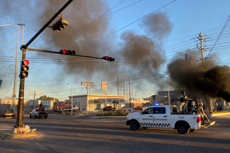 Members of the National Guard patrol the streets during an operation to arrest an alleged cartel leader in the Mexican city of Culiacan in January 2023 (Marcos Vizcarra)