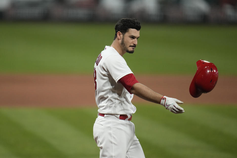 St. Louis Cardinals' Nolan Arenado tosses his helmet after striking out to end the eighth inning of a baseball game against the Cincinnati Reds Friday, June 4, 2021, in St. Louis. (AP Photo/Jeff Roberson)